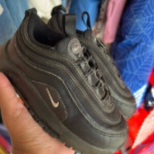 Nike Kids Black Low-Top Sneakers with Metallic Swoosh